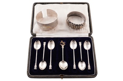 Lot 399 - A contemporary .999 standard silver bangle; and silver spoons