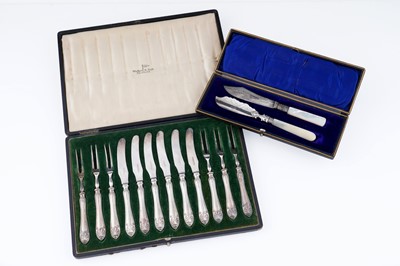 Lot 402 - A set of six fruit knives and forks; and two butter knives