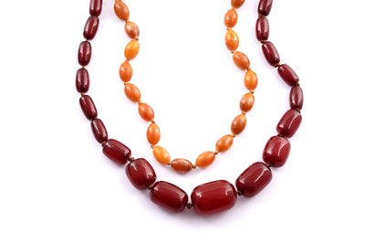 Lot 732 - An amber bead necklace and another