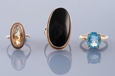 Lot 319 - Three gemstone rings including a late 1960s citrine ring