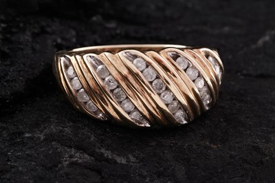 Lot 238 - A modern diamond ring with spirally fluted decoration