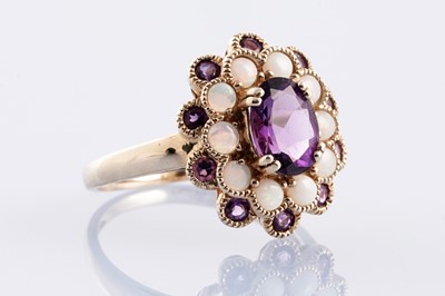 Lot 239 - An opal and amethyst dress ring