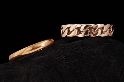 Lot 241 - A 1960s 22ct gold wedding band, and a 9ct gold curb-link pattern ring
