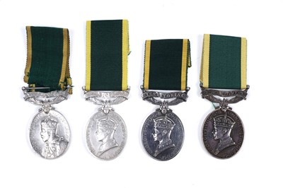 Lot 43 - Four territorial efficiency medals
