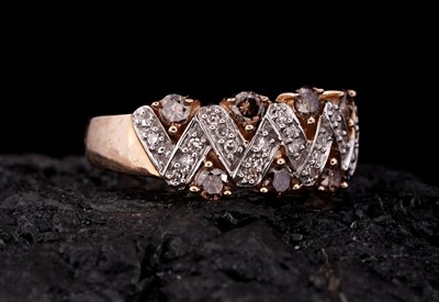 Lot 244 - A modern white and champagne diamond ring