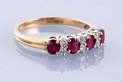 Lot 246 - A modern ruby and diamond ring