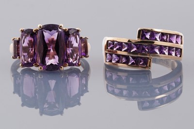 Lot 247 - Two contemporary amethyst dress rings