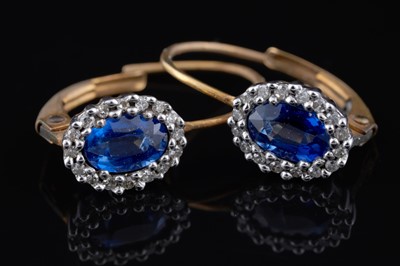 Lot 251 - A pair of sapphire and diamond pendant earrings