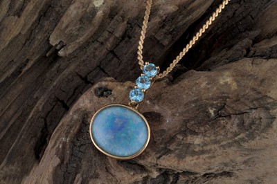 Lot 265 - A Gilson opal and Swiss blue topaz pendant