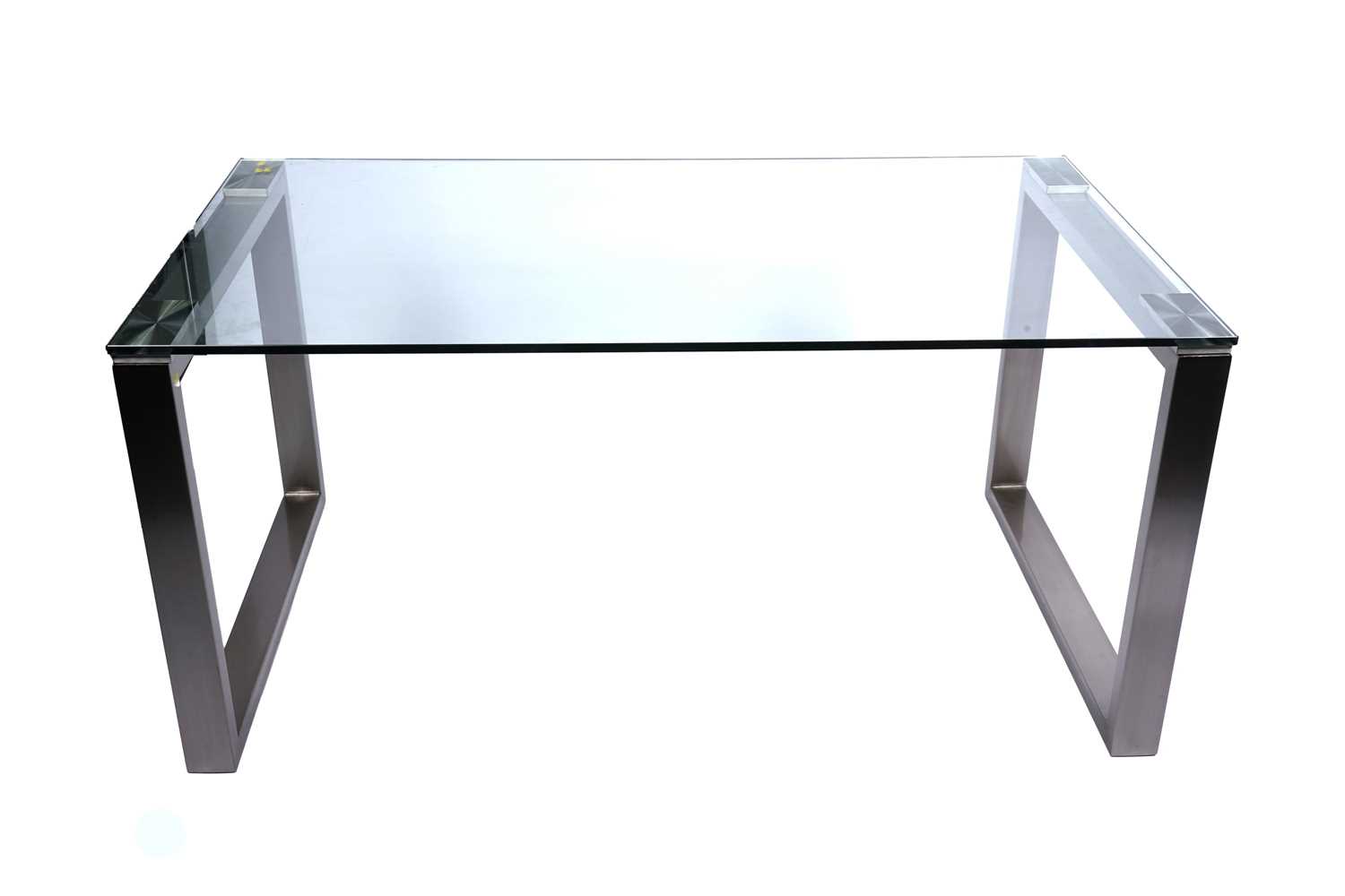 Lot 115 - A contemporary glass top dining table
