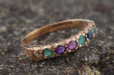 Lot 215 - A modern acrostic ring spelling out the word "Dearest"