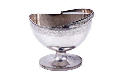 Lot 165 - An Edwardian silver swing-handled sugar basket