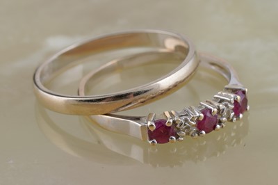 Lot 221 - A ruby and diamond half hoop eternity ring; and an 18ct gold band