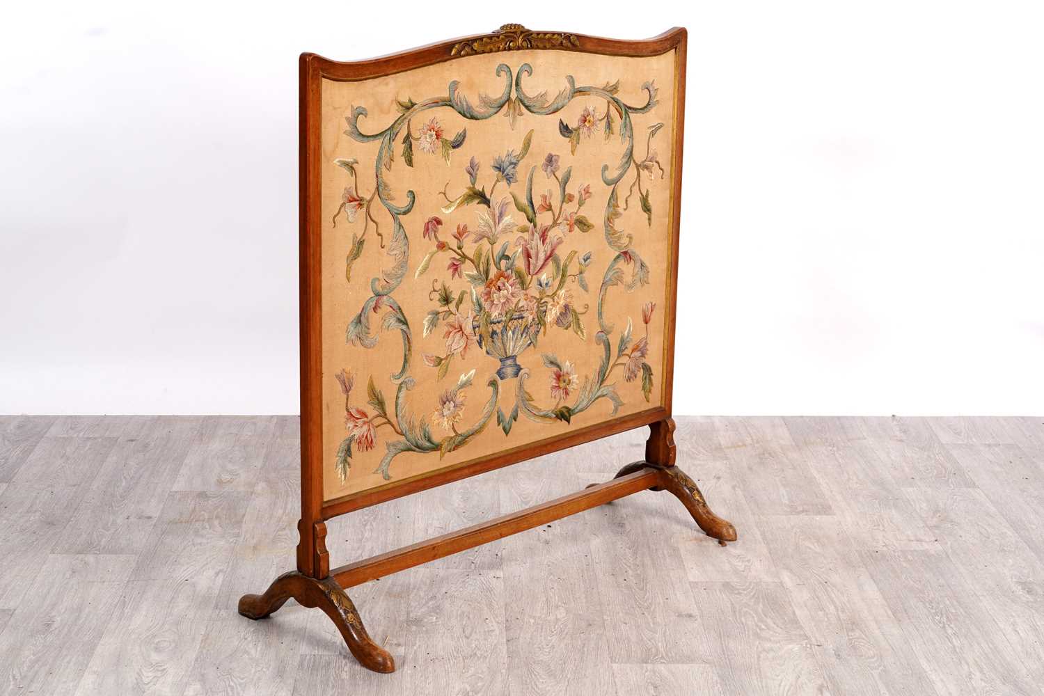 Lot 203 - An early 20th Century walnut fire screen