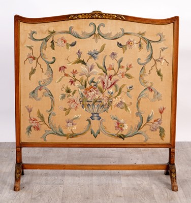 Lot 203 - An early 20th Century walnut fire screen