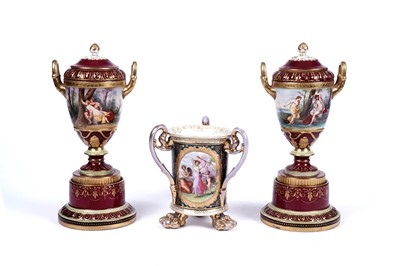 Lot 213 - A pair of Vienna porcelain twin-handled lidded vases; and a Vienna tyg