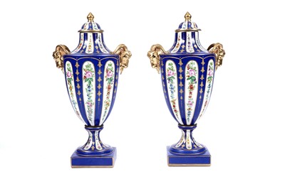 Lot 216 - A pair of early 20th Century Kalk type porcelain lidded vases