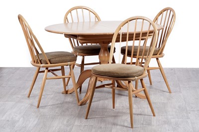 Lot 91 - Ercol dining table and four chairs