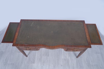 Lot 19 - A Georgian-style serpentine-fronted writing desk