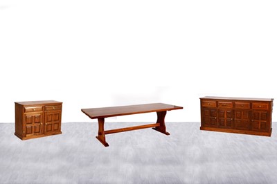Lot 20 - A contemporary elm three-piece dining room suite
