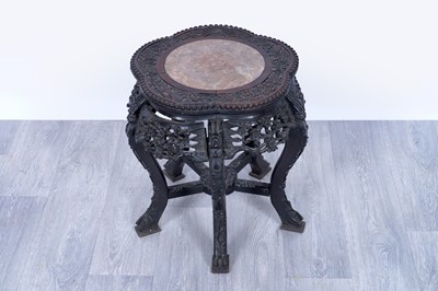Lot 21 - An early 20th Century carved Chinese hardwood jardinière stand