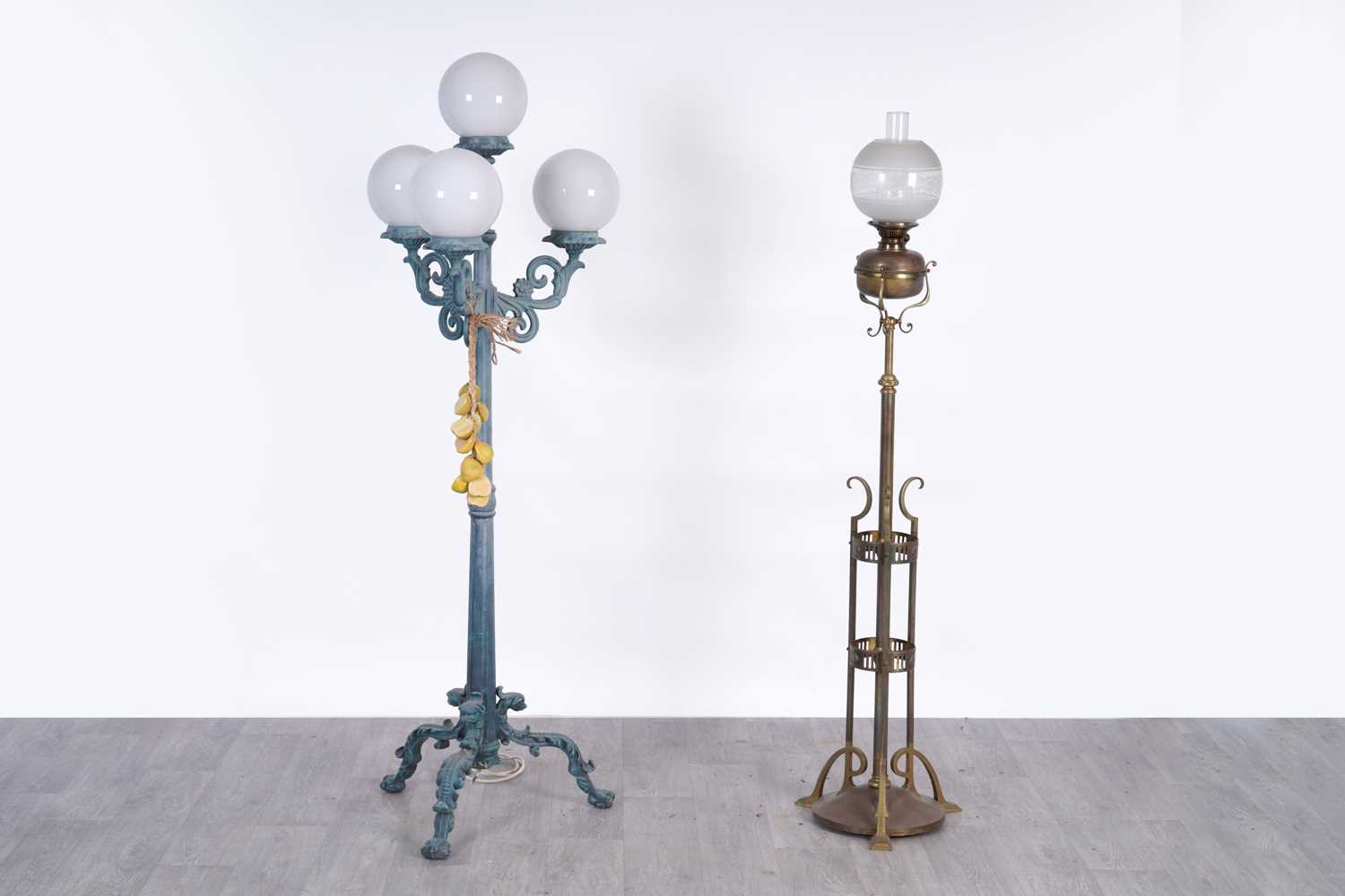 Lot 108 - A late 19th/early 20th Century Art Nouveau brass standard oil lamp; and a three branch lamp