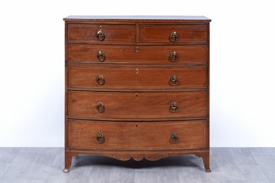 Lot 24 - A George III inlaid mahogany bowfront chest of drawers