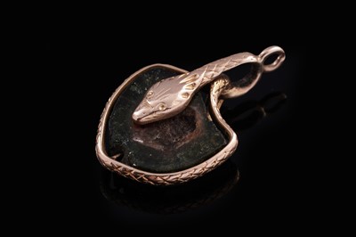 Lot 313 - A Victorian watermelon tourmaline set serpentine pendant