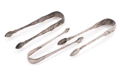 Lot 394 - Three pairs of Georgian silver sugar tongs