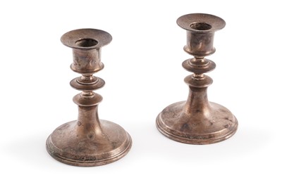 Lot 453 - A pair of Edwardian silver candlesticks