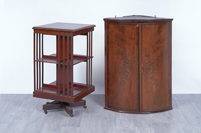 Lot 42 - An Edwardian revolving bookcase; and a Georgian inlaid mahogany corner cabinet