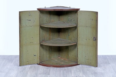 Lot 42 - An Edwardian revolving bookcase; and a Georgian inlaid mahogany corner cabinet