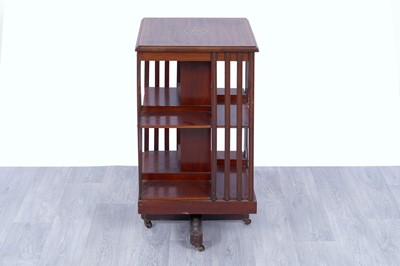 Lot 42 - An Edwardian revolving bookcase; and a Georgian inlaid mahogany corner cabinet
