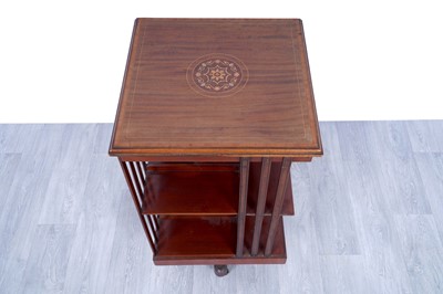 Lot 42 - An Edwardian revolving bookcase; and a Georgian inlaid mahogany corner cabinet