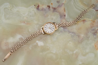 Lot 206 - Omega: a lady's gilt-cased cocktail watch on a gold strap