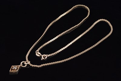 Lot 231 - A diamond-shaped pendant on a 9ct gold chain