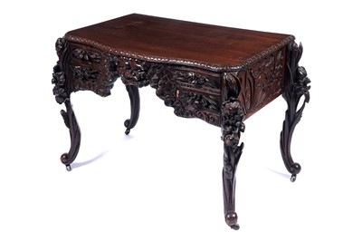 Lot 613 - A 20th Century heavily carved ornate side table