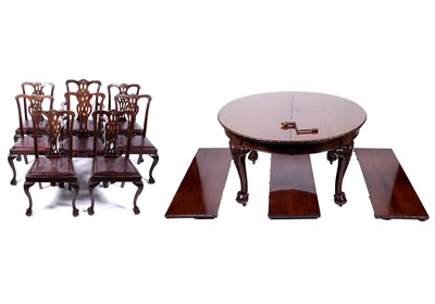 Lot 614 - An early 20th Century mahogany circular wind-out dining table; and eight chairs