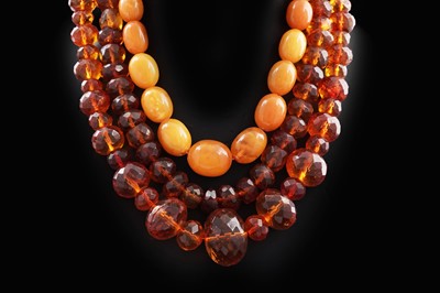 Lot 660 - Three amber necklaces