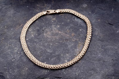 Lot 165 - A contemporary 9ct gold woven necklace