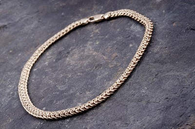 Lot 165 - A contemporary 9ct gold woven necklace