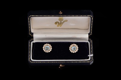 Lot 737 - A pair of aquamarine and diamond cluster earrings