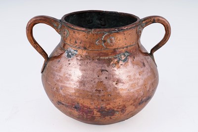 Lot 182 - A Georgian twin handled copper cauldron
