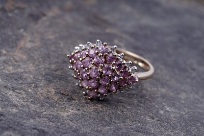 Lot 175 - A contemporary pink topaz and diamond ring