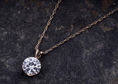 Lot 176 - A contemporary cubic zirconia pendant necklace, on 14ct gold