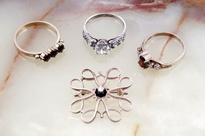 Lot 180 - A diamond-set Victoriana brooch; a 1970s garnet ring; and further similar rings