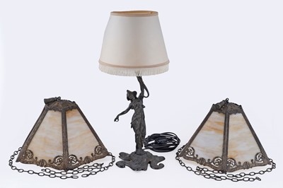 Lot 167 - An Art Nouveau silver plated spelter figural table lamp; and a pair of shades