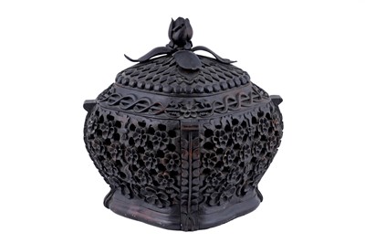Lot 295 - A heavily carved early 20th Century Burmese hardwood censer