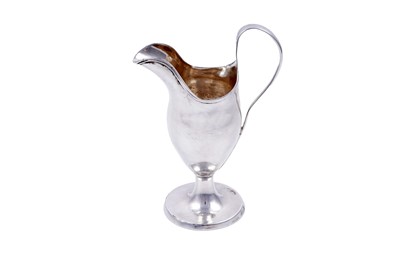 Lot 385 - A Scottish provincial silver cream jug of helmet form