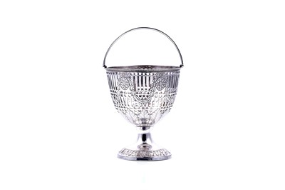 Lot 462 - A George III Scottish silver swing handled sugar basket